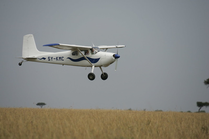 An aircraft flying above the Maasai Mara National Reserve on a 3 Day Fly in Safari to Maasai Mara National Reserve Vibrant Holiday Safaris